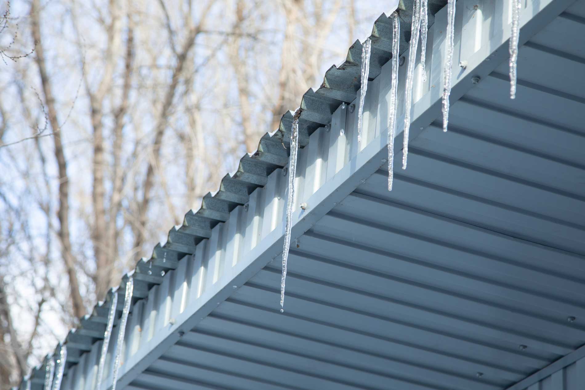 Navigate to section: Are Ice Dams Harmful to Metal Roofs?