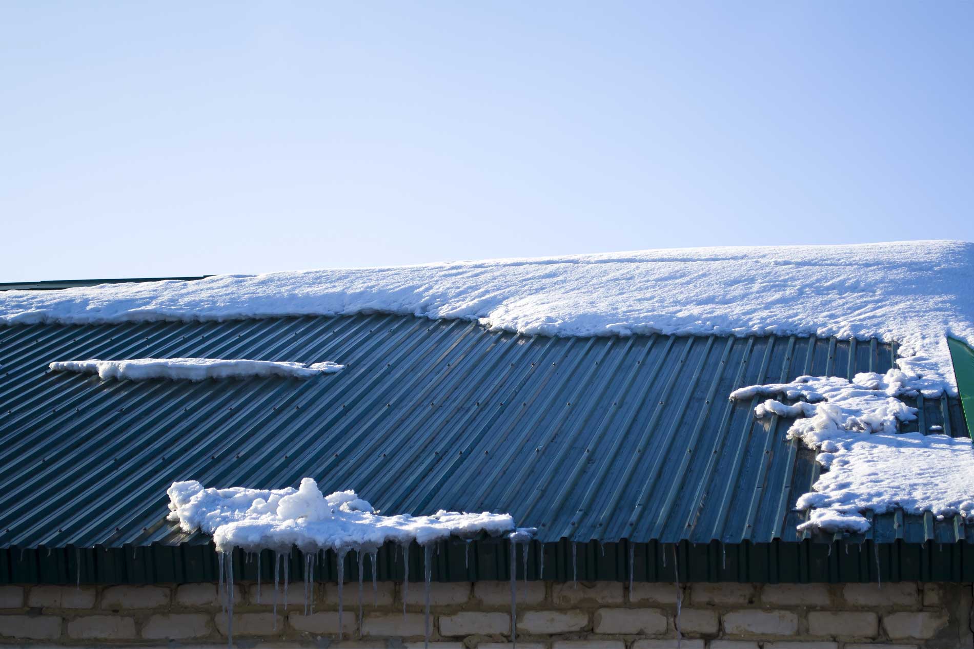 Westman Steel Blog: Understanding and Managing Ice Dams on Metal Roofs