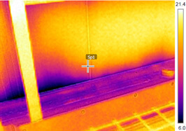 The Importance Of Sealants When Installing Insulated Metal Panels: This Insulated Metal Panel (IMP) Install picture demonstrates issues doe to the lack of and broken sealant between base support angles and base trim.